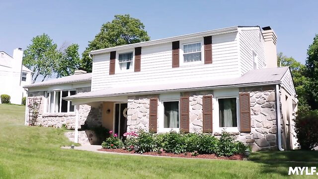 Lolly Dames Milfty busty MILF in front of charming white house
