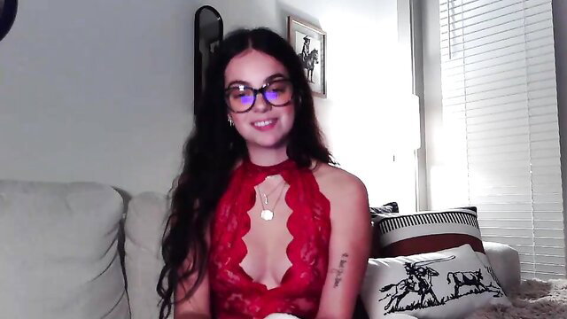 Willowbelle in sexy red lace lingerie, smiling with glasses