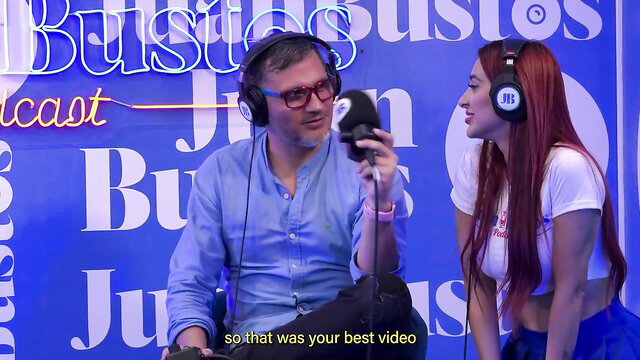 Jessica Sodi on Juan Bustos podcast in tight top and headphones