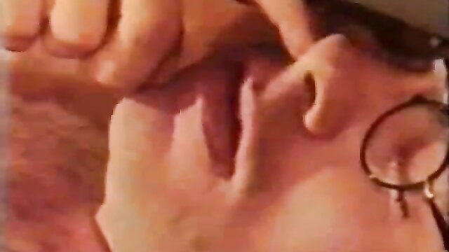 Classic 8mm closeup of man gripping woman's face in vintage Fortuna porn