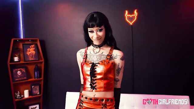 Briella Coley goth tattooed beauty in red latex corset top