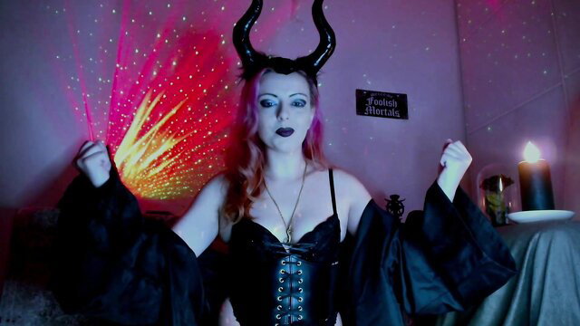 Gothic babe in black corset and horns goons for Lilith in Satanic sex mass