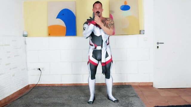 Muscle dude in tight spandex Gundam cosplay suit posing