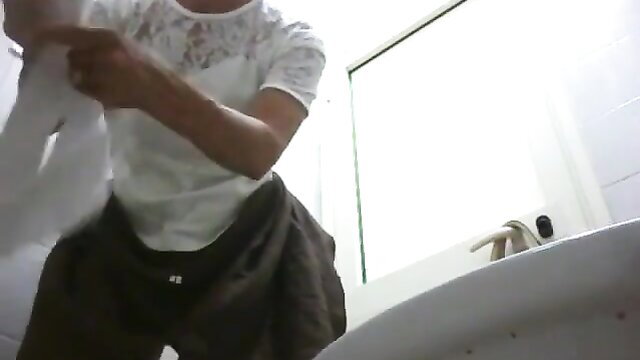 Brunette amateur squats to poop in bathroom hidden cam