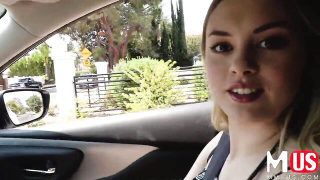 Blonde Amber Moore in car smiling at stranger pickup