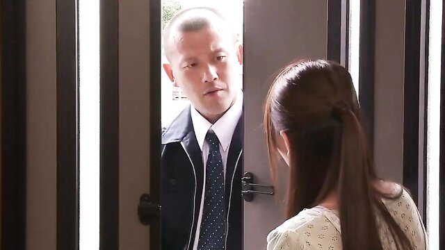 Asian man in suit talks to long-haired woman's back at door in JAV creampie tease