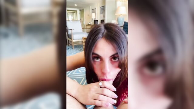 POV closeup of seductive brunette girl with red lips teasing finger in mouth