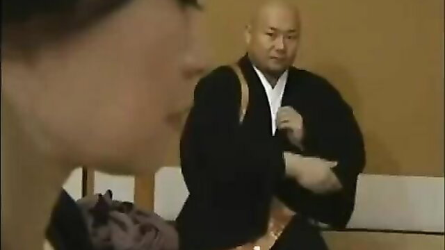 Japanese woman with older bald man in kimono, intimate JAV scene