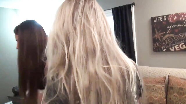 Blonde boss in leather jacket humiliates with feet, long hair mirror view