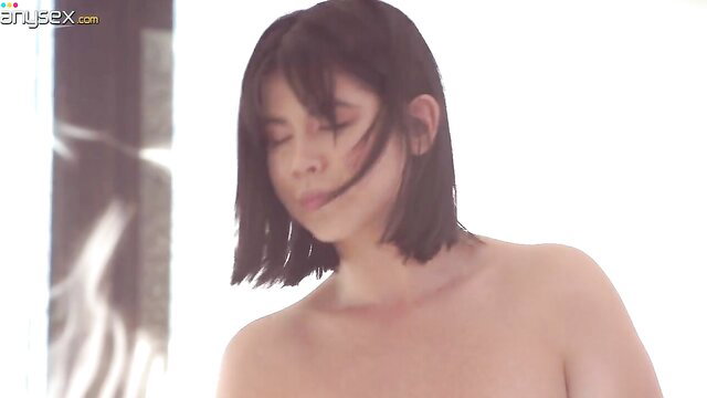 Beautiful Asian lesbian with bob haircut nude, intimate closeup