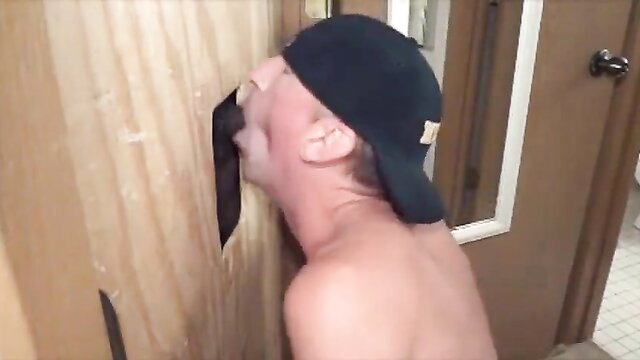 Man throating big black cock at gloryhole in amateur multiracial video