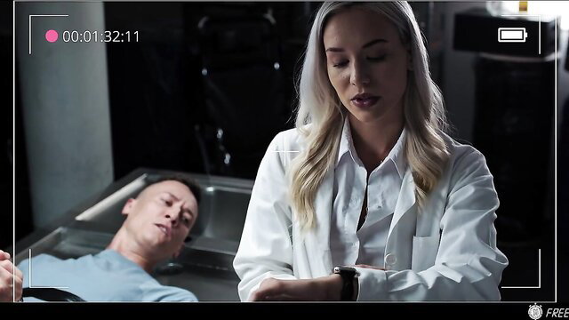 Blond doctor in lab coat checks unconscious man in time stop fetish scene