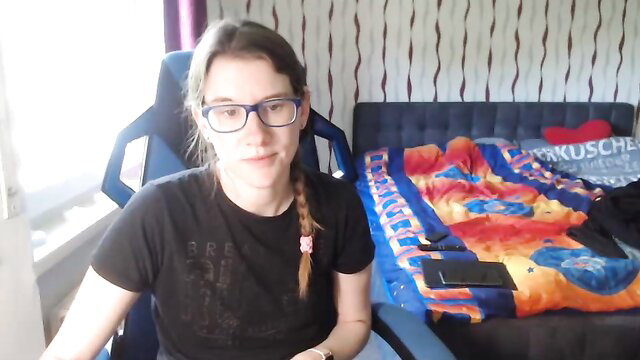 xinnocence94x German cam girl in glasses and braid smiling at camera