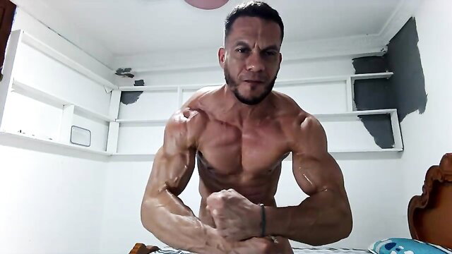 Hot Latin guy 37 flexing massive sweaty muscles shirtless