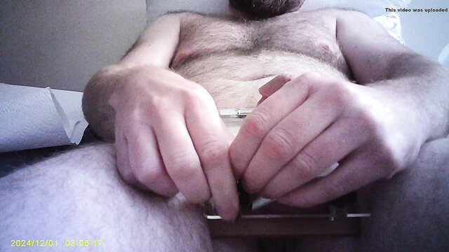 Hairy bearded man crushing hairy balls with vice device, part 2