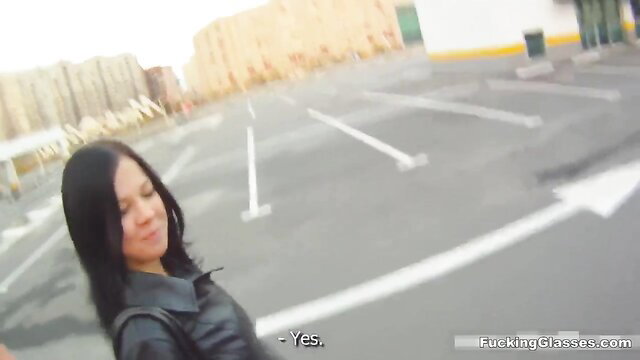 Asian cutie in leather jacket gives public parking lot blowjob