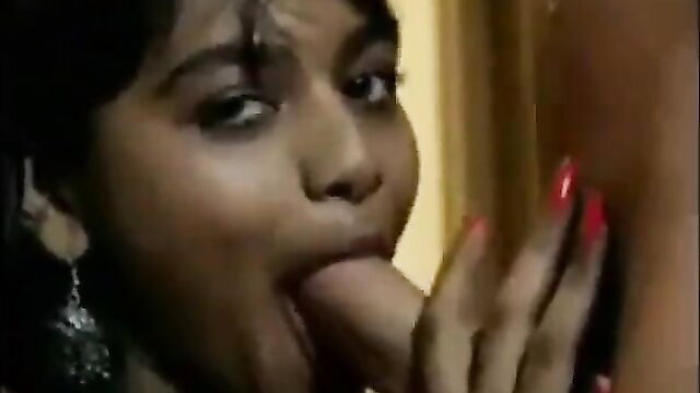Indian beauty with glossy lips sucking thick cock closeup