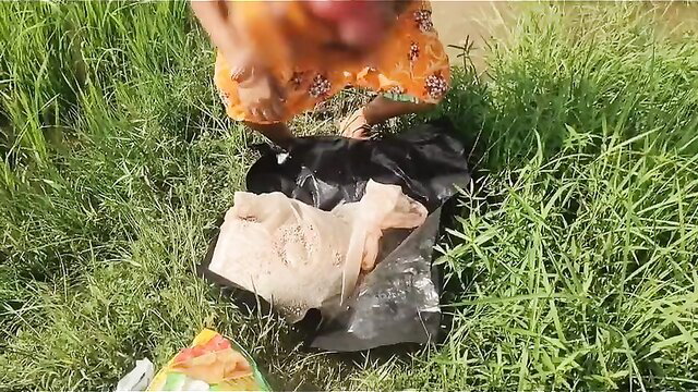 Indian village granny squats peeing in field, floral dress up, outdoor