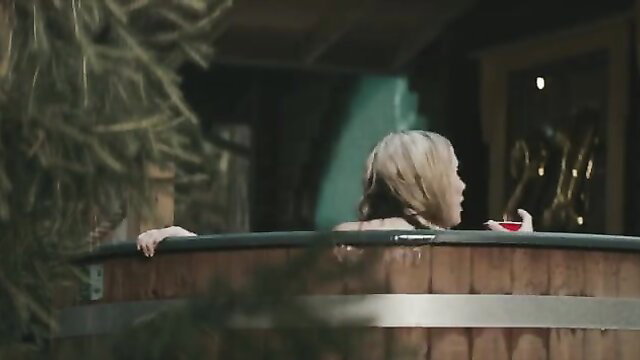 Blonde woman topless in hot tub, Eva Ray nude tits from Piglet horror