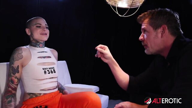 Bald tattooed punk vixen in cutout top and orange jumpsuit erotic interview