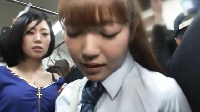 Two cute Japanese schoolgirls in uniforms groped on crowded train