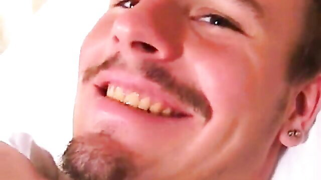 Smirking cowboy guy smiling closeup in adult video thumbnail