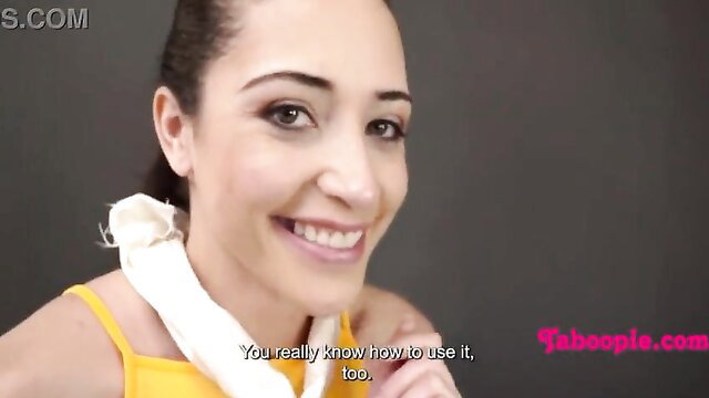 Smiling brunette in yellow top with white scarf teases taboo fun