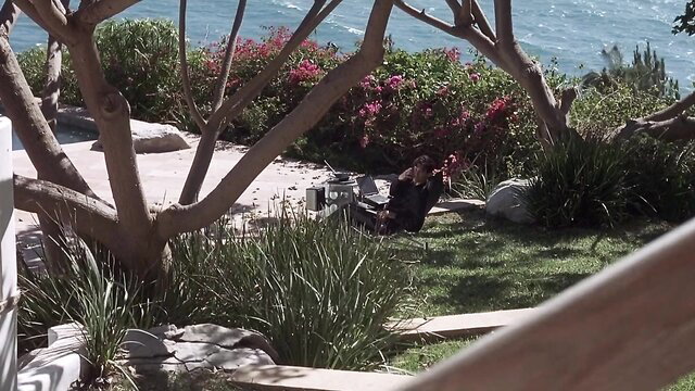 Andie MacDowell lounging seaside in dress, The End of Violence