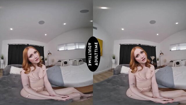 Redhead Scarlet Skies in lingerie sits seductively on bed