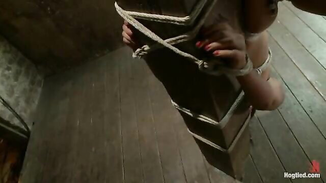 Skin Diamond bound in ropes, legs spread in intense BDSM session