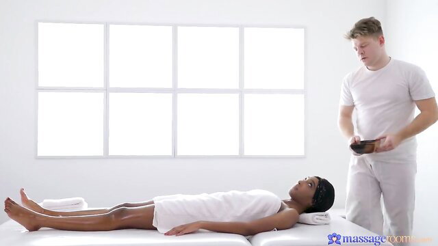 Asia Rae ebony babe in white towel on oil massage table