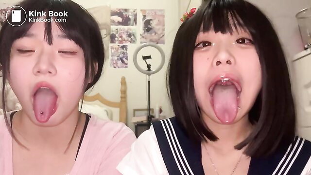 Kat10 and friend in sailor uniforms sticking tongues out, vomiting fetish tease