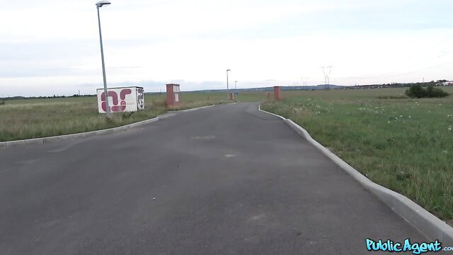 Thomas Hyka at outdoor entrance gate, sunny field view