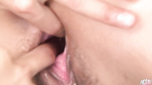 Japanese woman fingers shaved pussy closeup in uncensored JAV