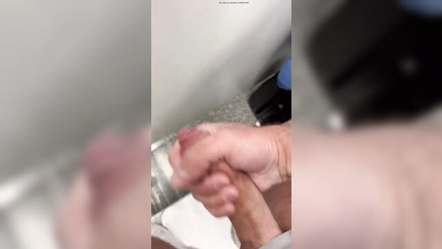 British BWC handjob cumshot in bathroom stall closeup