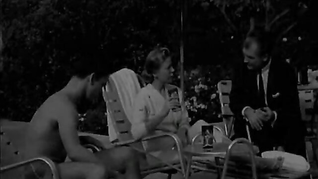 Vintage naturist stag film: nude Asian man chats with clothed blonde MILF poolside