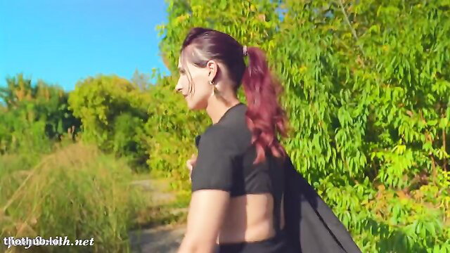 Jeny Smith in superhero costume walks outdoors, sexy back view
