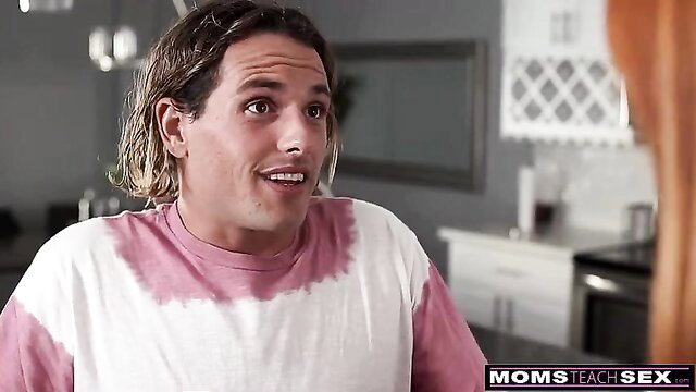 Shocked wet-haired guy talks to redhead stepmom in kitchen