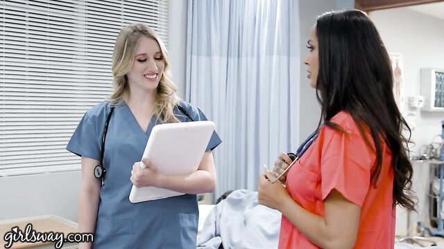 Hot rookie blonde nurse with big tits chats with superior ebony nurse