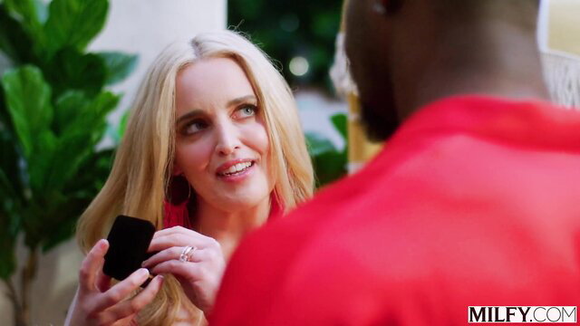 Blonde MILF Charlie Forde smiles at black stud Jax Slayher holding ring box