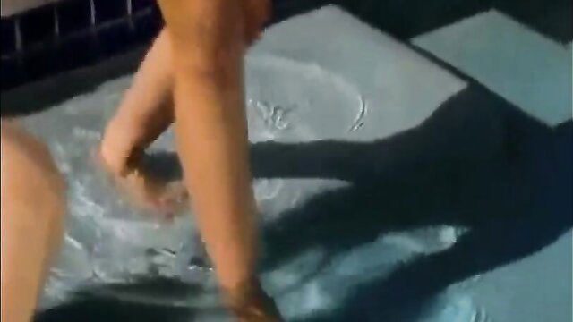 Glamour teen temptress legs spread in shallow water arousing tease