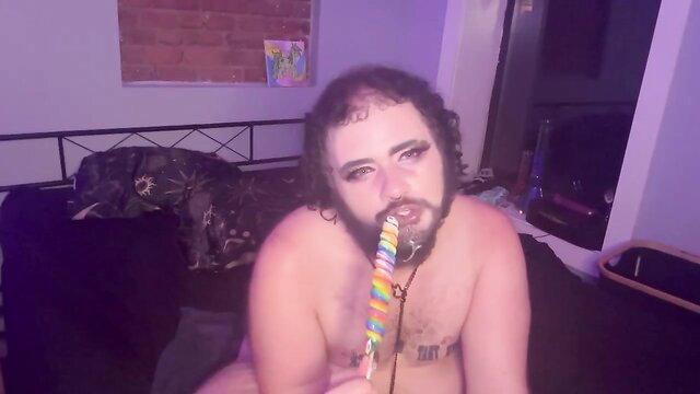 FTM cub sucks rainbow lollipop naked, hairy body exposed