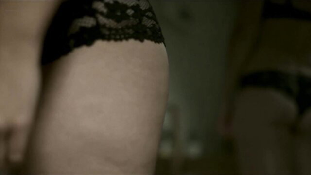 Closeup of woman's curvy ass in black lace thong lingerie