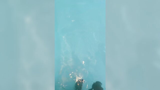 Lesbian flashing tits underwater at swimming pool