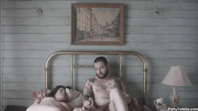 Flor Eduarda Gurrola nude in bed with bearded man stroking cock