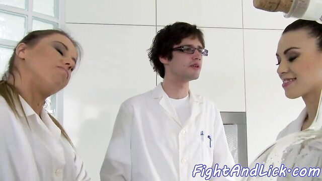 Hot nurses in lab coats wrestle and lick in lesbian threesome