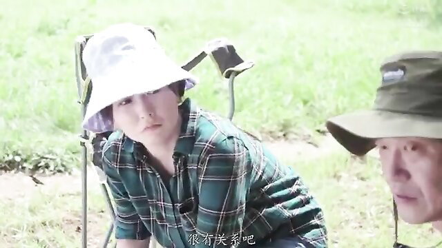 Asian wife swap JAV couple in plaid shirt and hats outdoors camping