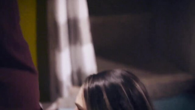 Athena Faris in dress by window, teasing Pure Taboo creampie scene