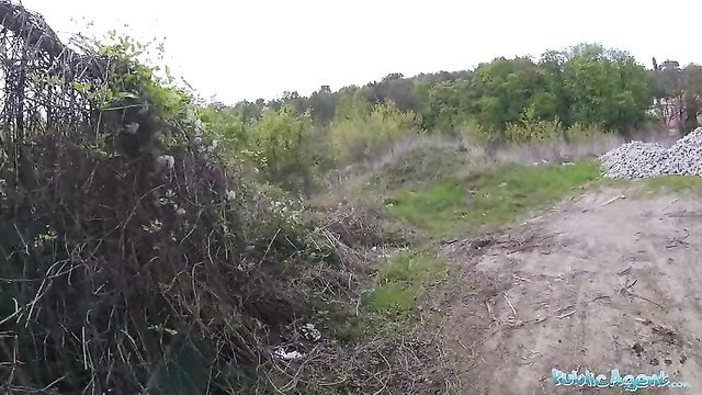 Outdoor Public Agent scene with overgrown weeds, gravel piles, no nudity visible