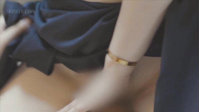 Asian beauty in black sari exposing hips and legs in erotic tease